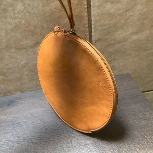 REMI/REID Circle Purse
Anthropologie, Remi/Reid burnt tan wristlet Vegan leather